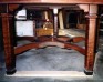 Close-up of curly redwood table legs.