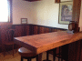 Redwood Bar with rainbow wainscoting, half panels, in background.