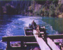 Skiff pushing pontoon barge