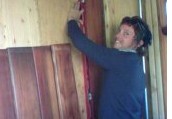Customer installing their new redwood paneling